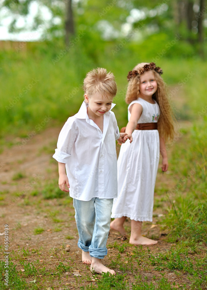 Portrait of a boy girl in a summer forest Portrait of a boy girl in a summer forest