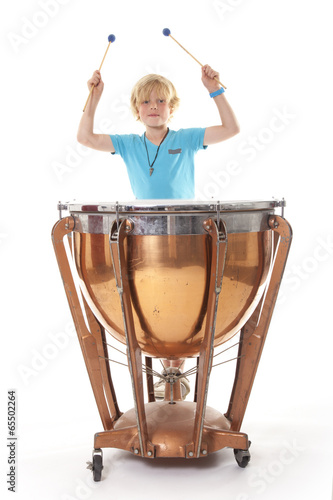 Photos young blond boy playing kettle drum