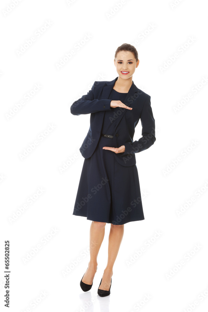 Business woman showing something or copyspase Business woman showing something or copyspase