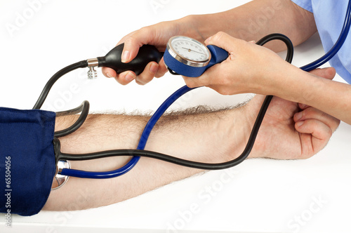 Doctor monitoring the blood pressure of a patient, isolated