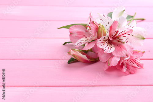 Fototapeta Naklejka Na Ścianę i Meble -  Beautiful Alstroemeria flowers on wooden table