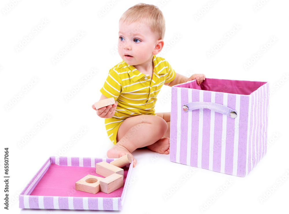 Cute little boy with wooden toy blocks isolated on white Cute little boy with wooden toy blocks isolated on white