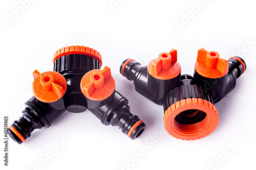 Adapter for connection of a garden hose with watering system