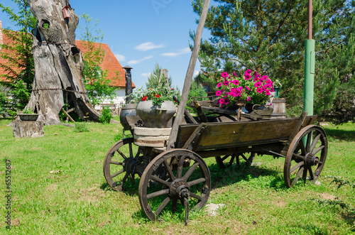 rustic wooden carriage with flower composition photo