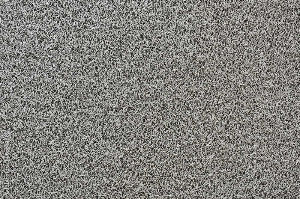 Close up of gray synthetic fiber texture of household scrubber Close up of gray synthetic fiber texture of household scrubber