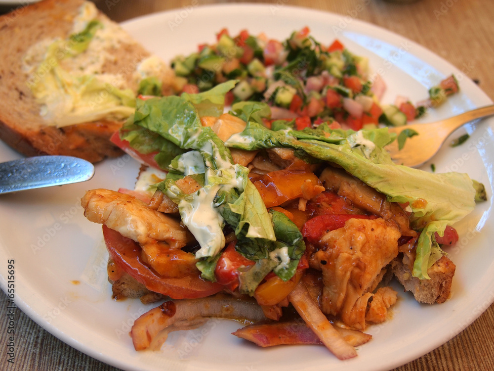Grilled chicken sandwich with tomato and lettuce Grilled chicken sandwich with tomato and lettuce