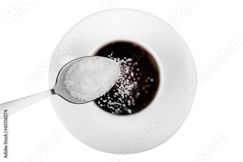 Cup of coffee with  sugar on white background