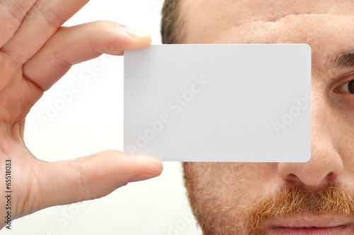 Man with a white card in hand photo