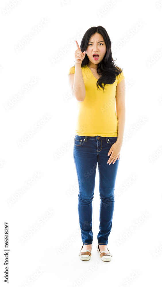 Upset young Asian woman scolding somebody Upset young Asian woman scolding somebody