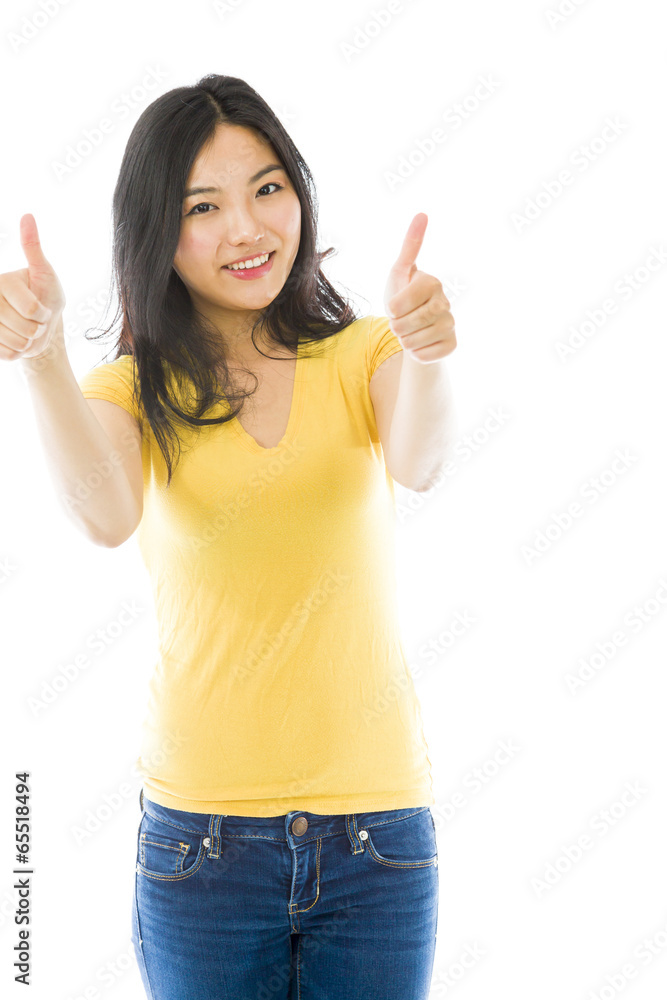 Smiling young Asian woman showing thumb up sign with both hands Smiling young Asian woman showing thumb up sign with both hands