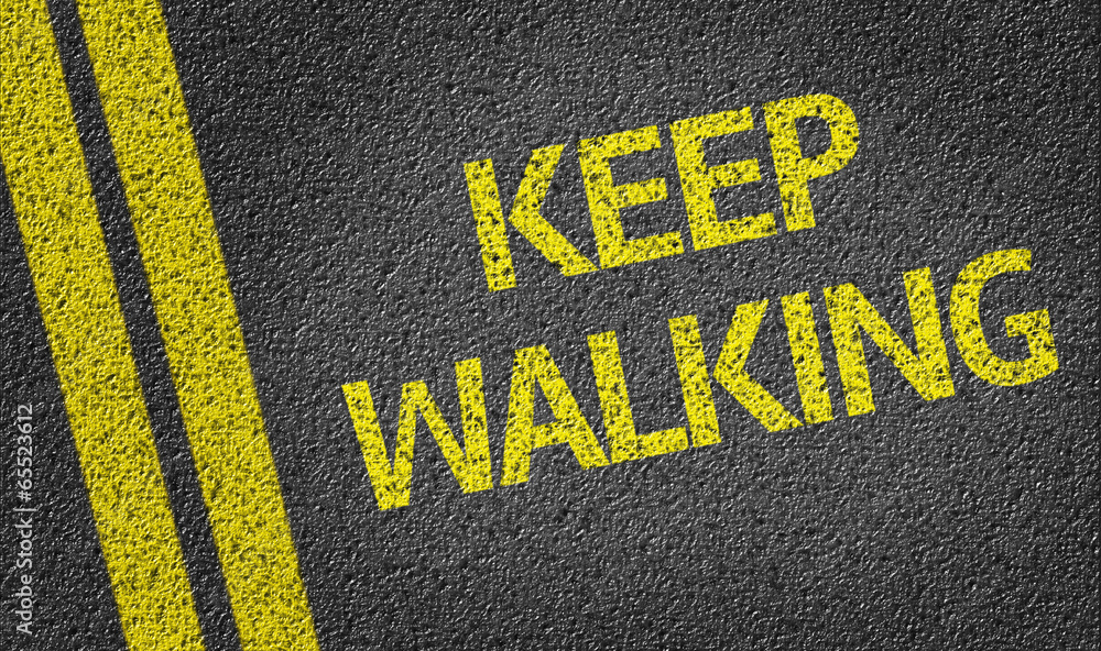 Keep Walking written on the road