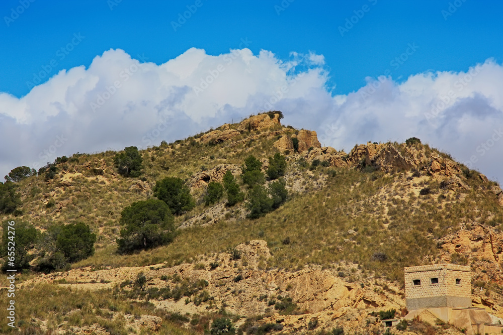 low altitude mountain arid zone and blue sky with clouds low altitude mountain arid zone and blue sky with clouds