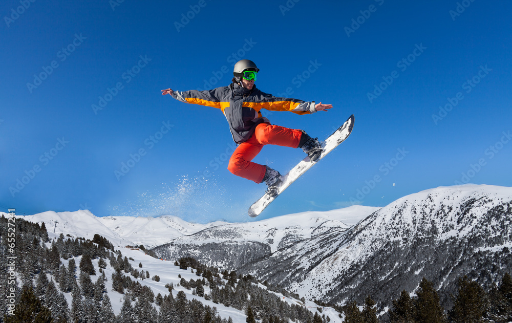 Snowboarder jumping high like ninja Snowboarder jumping high like ninja
