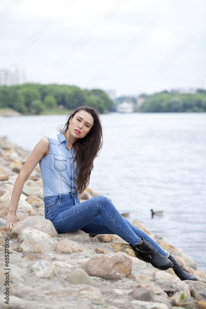 Sad woman sitting on rocks