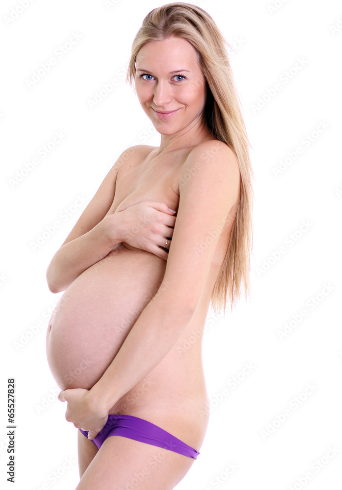 Naklejka premium undressed pregnant female holding her breasts