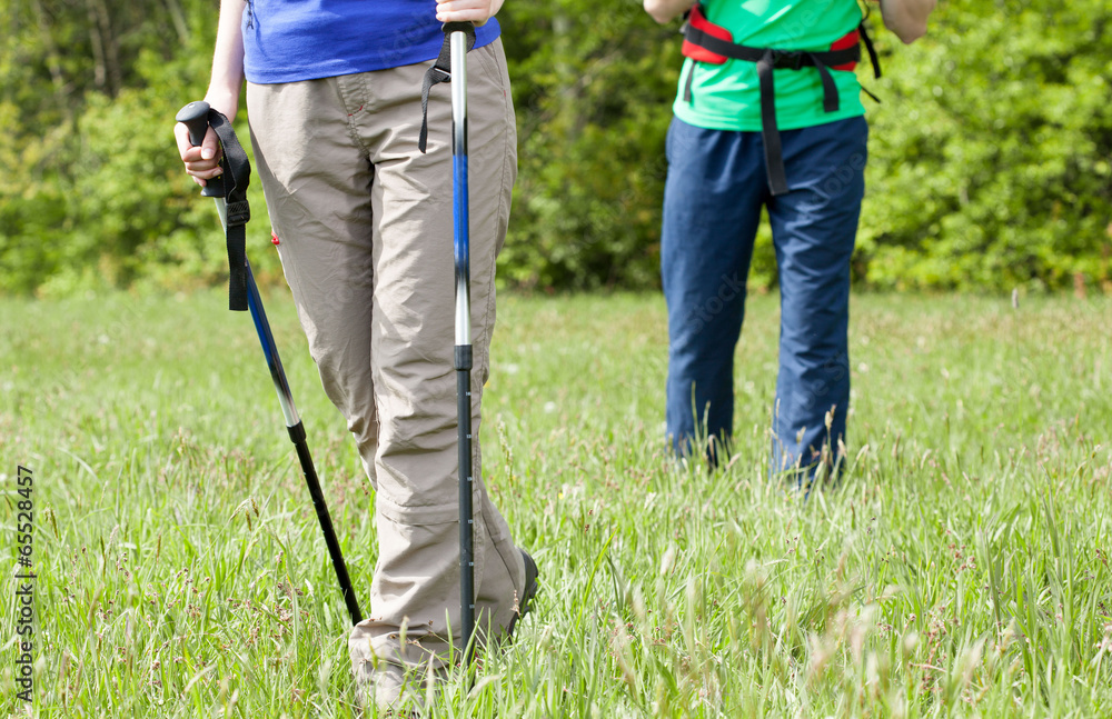 Legs of a young couple on country walk