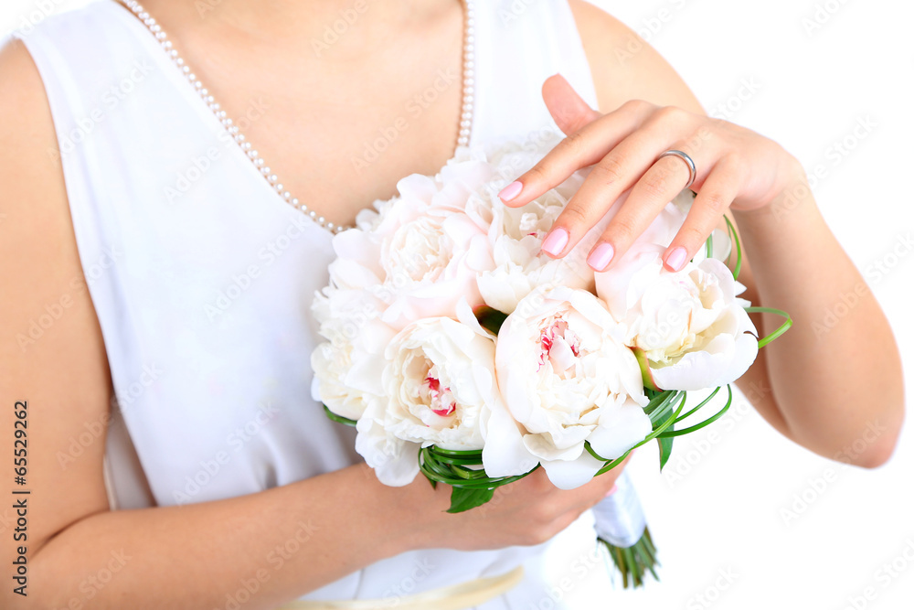 Bride holding wedding bouquet of white peonies, close-up