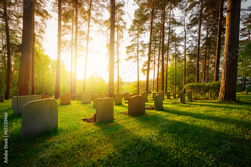 Canvastavla Graveyard in sunset with warm light