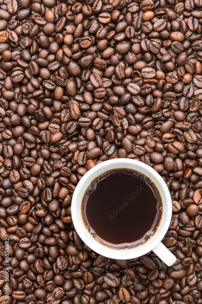 black coffee cup on coffee beans background black coffee cup on coffee beans background