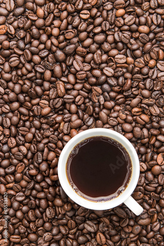 black coffee cup on coffee beans background