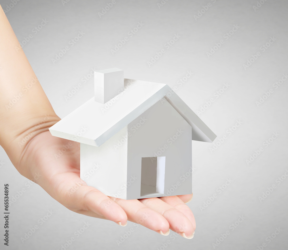 holding house representing home ownership holding house representing home ownership