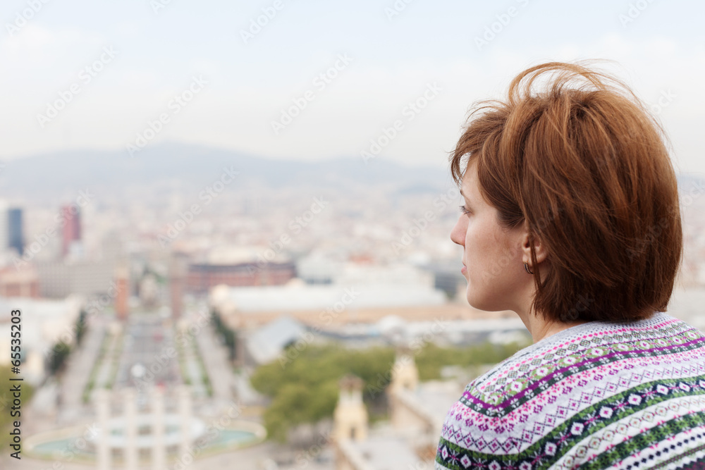  woman against panorama of Barcelona