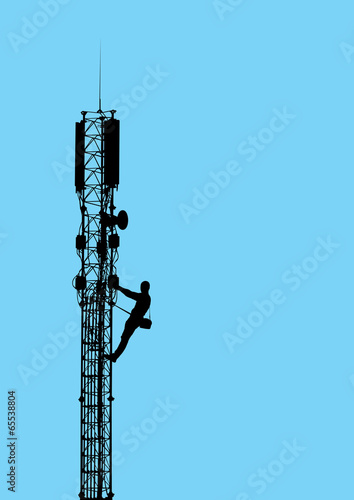 Silhouette of worker climbing on mobile telecommunication tower.