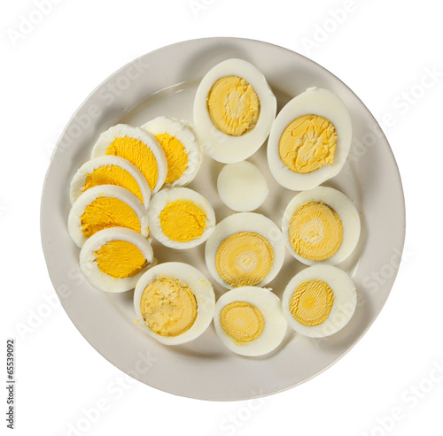 Plate with sliced eggs ( isolated on white background )