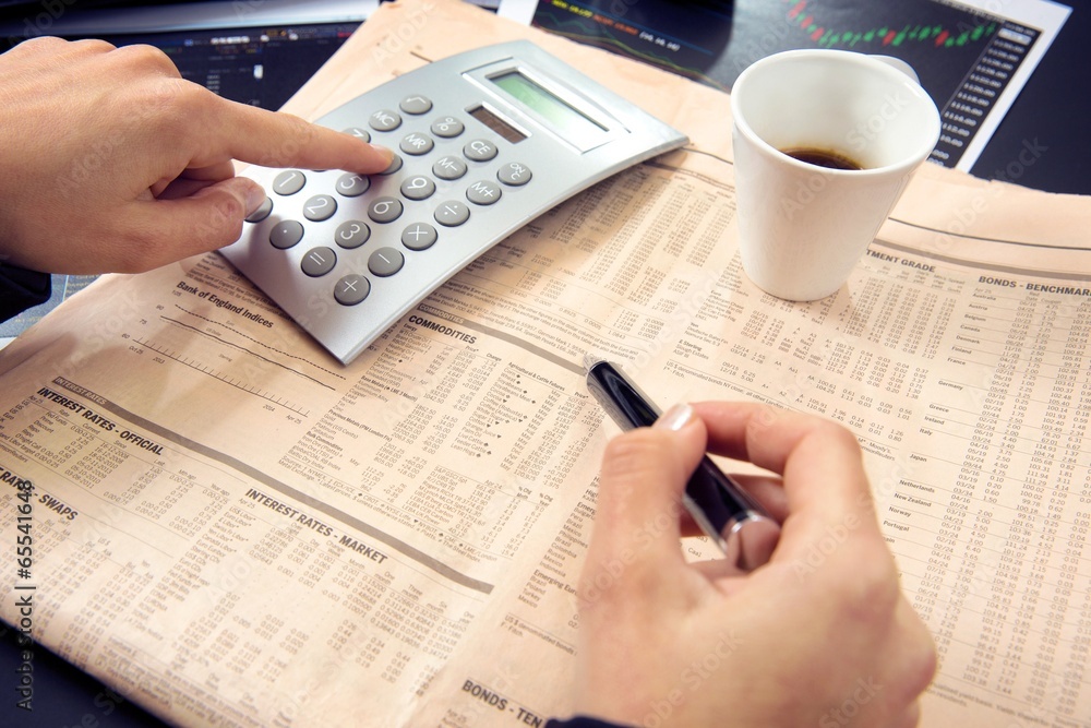 Close up of a business woman calculating. Close up of a business woman calculating.