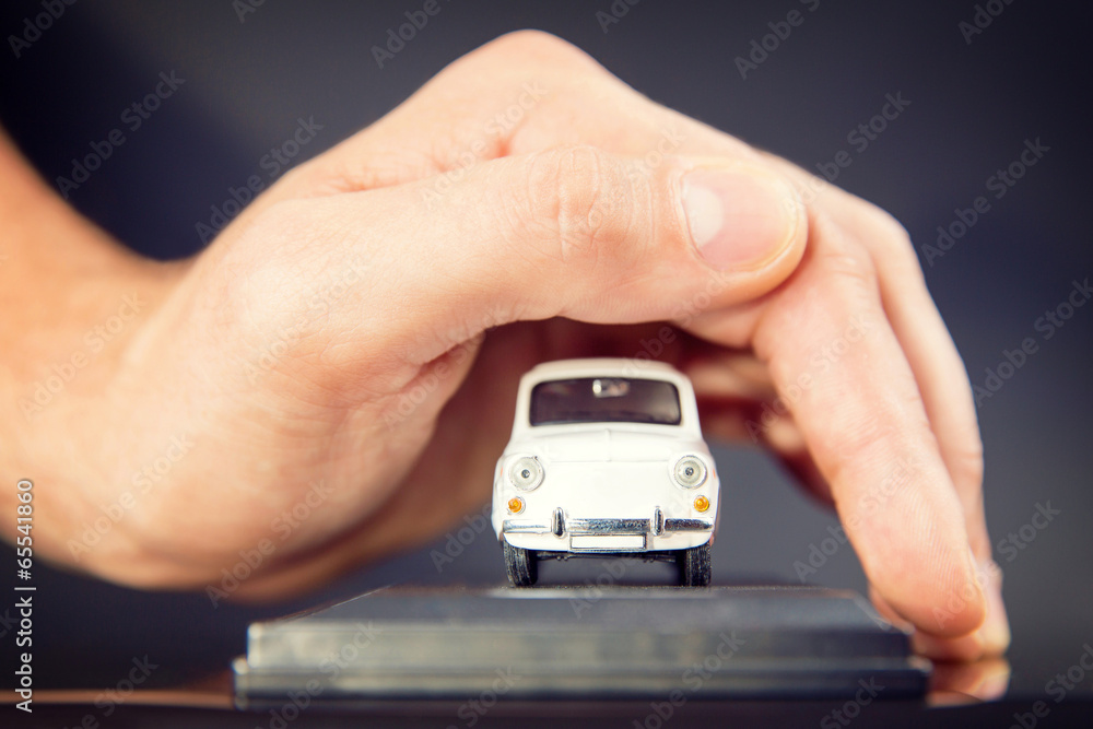 Car (automobile) insurance. Businessman with protective gesture. Car (automobile) insurance. Businessman with protective gesture.