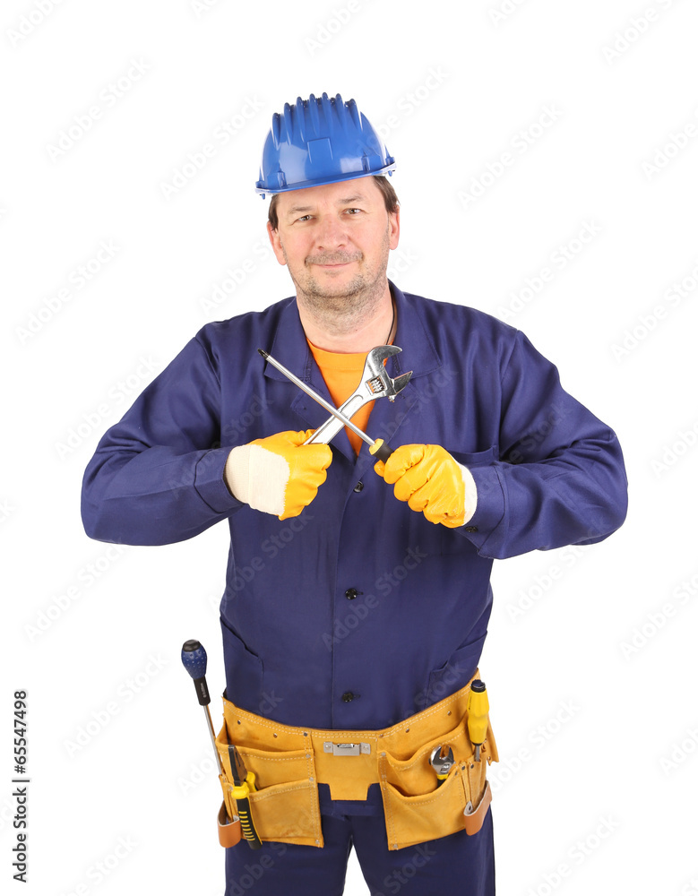 Worker in hard hat with screwdriver. Worker in hard hat with screwdriver.