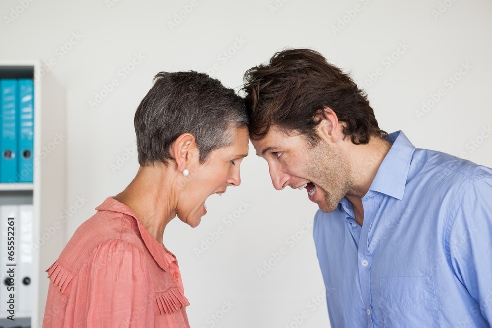 Angry business people shouting at each other Angry business people shouting at each other