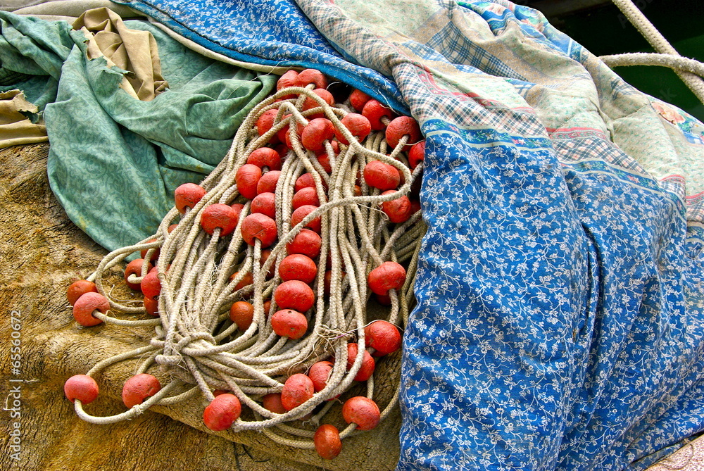 Fishing boat with net and some belongings.