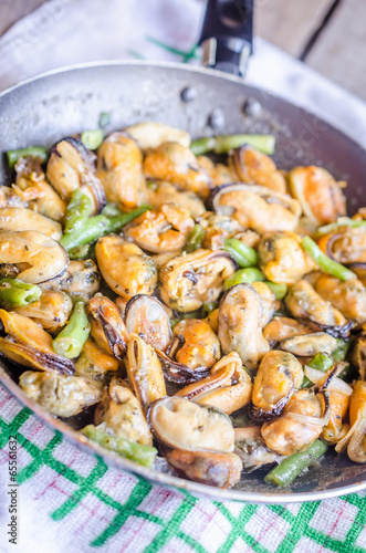 Fried mussels on the pan