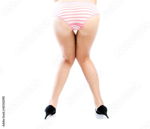 Woman in high heels with buttocks pink panties