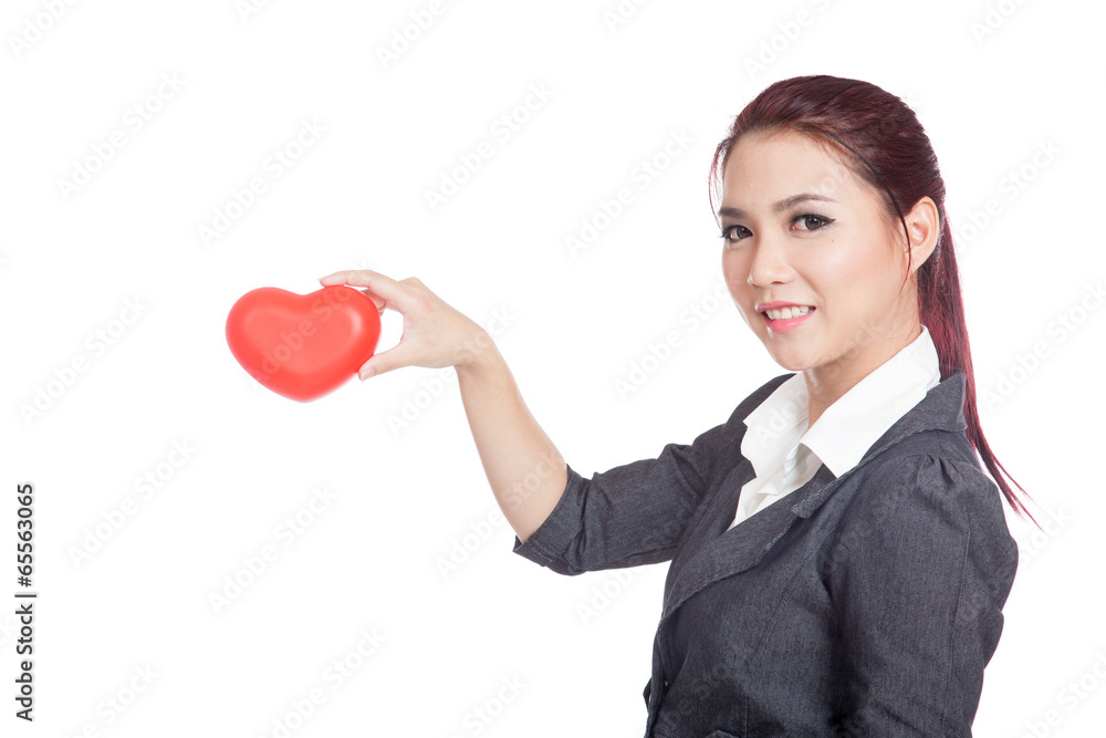 Asian businesswoman pick a red heart in the air Asian businesswoman pick a red heart in the air