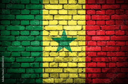 Brick wall with painted flag of Senegal