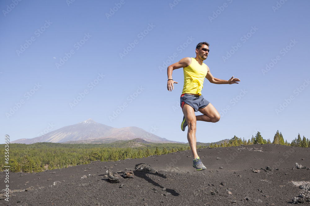 Man running outdoors, cross country trail run Man running outdoors, cross country trail run