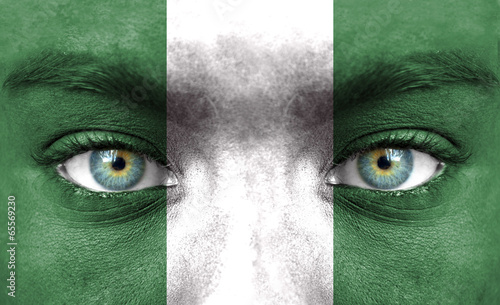 Human face painted with flag of Nigeria