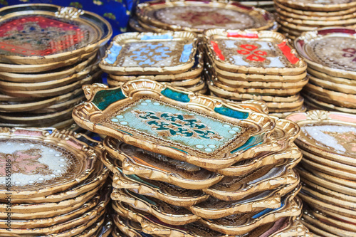 Ornate golden trivets and tablets