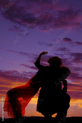 silhouette woman lean back on man hand over face