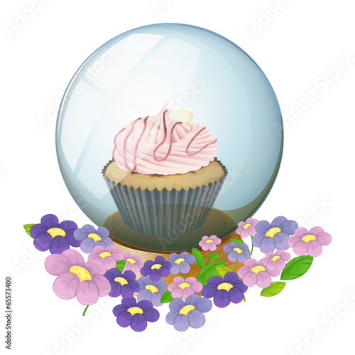 A crystal ball with a cupcake and flowers