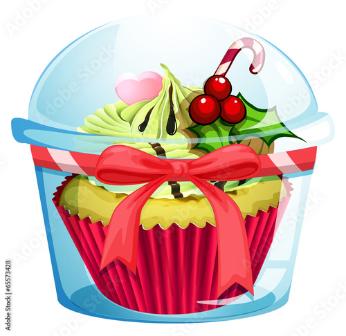 A clear disposable transparent container with a cupcake