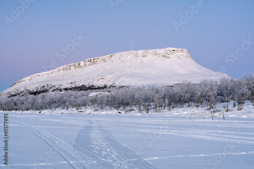 View of Saana Hill from Kilpisjarvi lake in winter, Finland