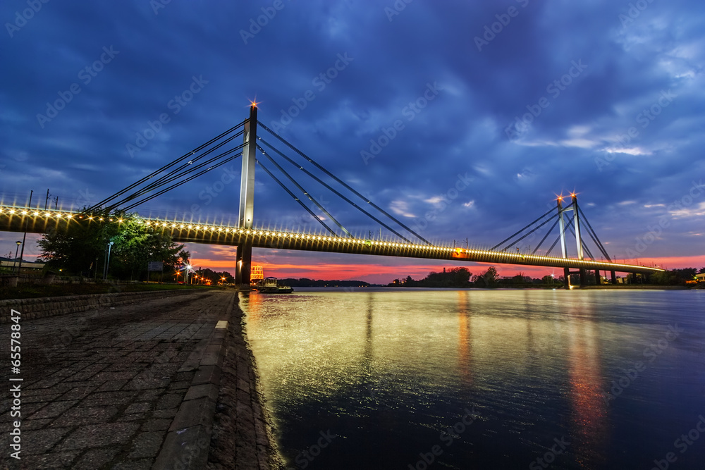 Bridge across river at night