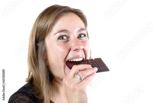 young woman eating chocolate