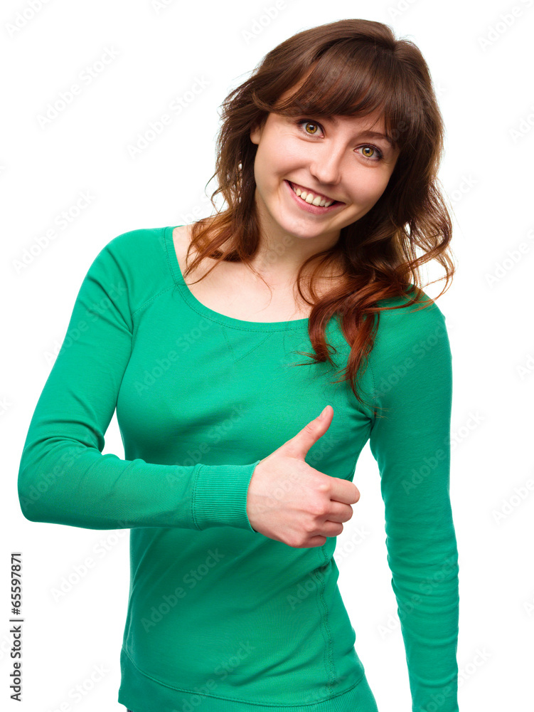 Woman is showing thumb up gesture Woman is showing thumb up gesture