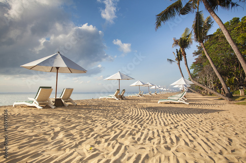 Beds and umbrella on a tropical beach