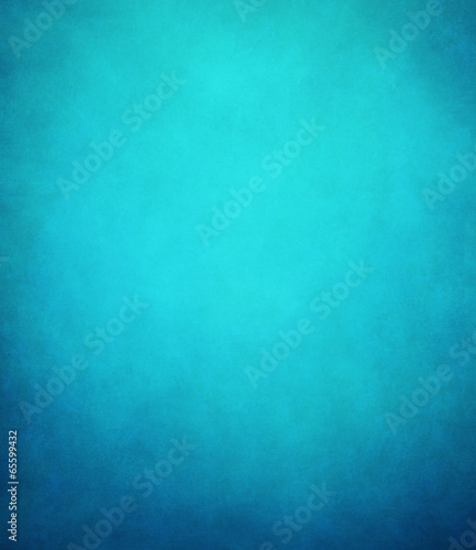 abstract blue background or dark paper with bright center spotli