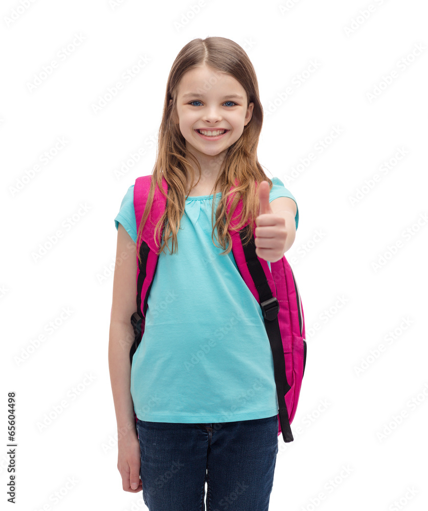 smiling girl with school bag showing thumbs up smiling girl with school bag showing thumbs up